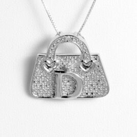 Ezüst táska bross-medál "D" betűvel
